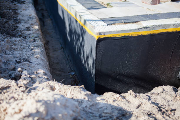 Professional Waterproofing technician working in Niles, OH